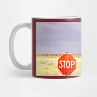 Stop sign in approach road to Monument Valley Mug